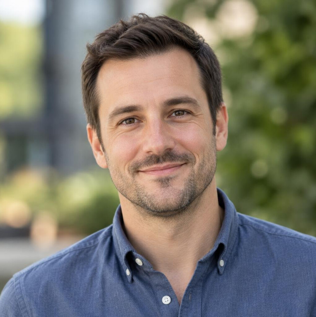 Portrait of a man with short dark hair in casual shirt